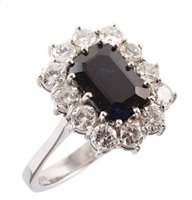 Lot 101 - Sapphire and diamond rectangular cluster 18ct white gold ring