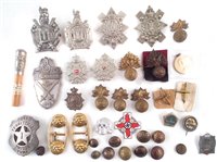 Lot 238 - Cap badges and other army uniform decorations
