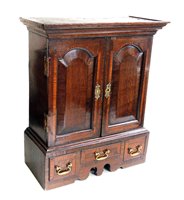 Lot 346 - George III oak spice cabinet.