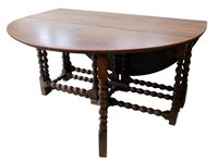Lot 363 - Late 18th century oak oval drop-leaf table.