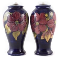 Lot 82 - Pair of Moorcroft vase lamp bases decorated with Clematis pattern
