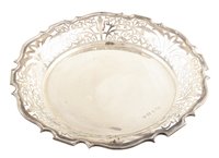 Lot 107 - A silver dish on three scroll feet with pierced decoration, marks for William Atkin, Birmingham, 1907, gross weight 12.63ozt