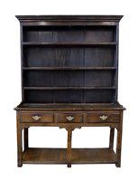 Lot 375 - George III oak cottage dresser.