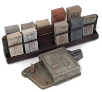Lot 39 - Bell Punch bus ticket stamp no. 76504, together with a ticket rack and unused tickets.