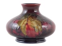 Lot 73 - Moorcroft flambe vase, decorated with leaves and berries pattern