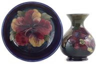 Lot 78 - Moorcroft vase and a bowl, decorated with Hibiscus and Clematis patterns