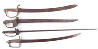 Lot 189 - Three cutlasses or short swords and a court sword