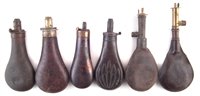 Lot 123 - Four powder flasks and two shot flasks