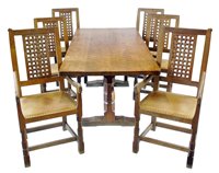 Lot 324 - Mouseman table and six Mouseman chairs
