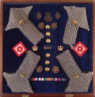 Lot 242 - Cased display containing Duke of Lancaster's cap badges