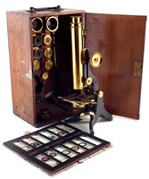 Lot 187 - Swift & Son, Tottenham Court Road, London, lacquered brass and blued steel monocular microscope.