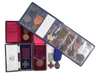 Lot 303 - Album of mixed late 19th early 20th century medals and two others.