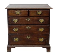 Lot 464 - George III oak chest of two short and three long drawers.