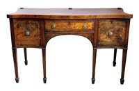 Lot 468 - George III figured mahogany serpentine front sideboard.