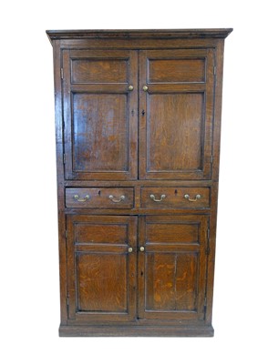 Lot 460 - George III oak four door cupboard with panelled doors and two drawers, 105cm wide.
