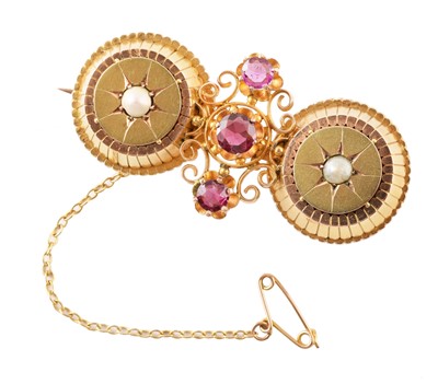 Lot 89 - A Victorian Etruscan style double target brooch with compartments to reverse.