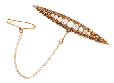 Lot 86 - An opal and diamond set 15ct gold bar brooch.