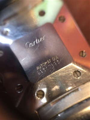 Lot 137 - A Cartier Santos steel and gold wristwatch.
