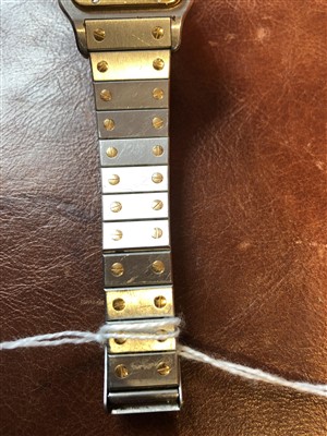 Lot 137 - A Cartier Santos steel and gold wristwatch.