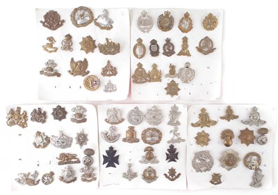 Lot 217 - Sixty six cap badges mounted on cards
