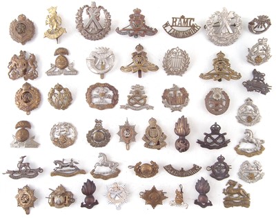 Lot 187 - Forty five cap badges