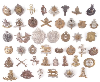 Lot 192 - Forty five cap badges