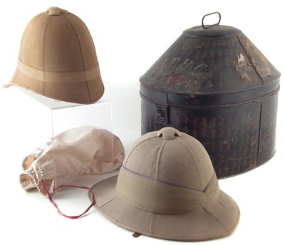 Lot 219 - Two Pith helmets, one with tin case, Boer war era