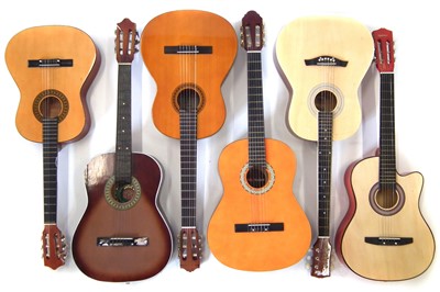 Lot 52 - Six nylon strung guitars