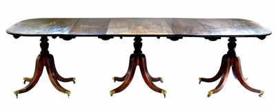 Lot 518 - George III mahogany three-pillar dining table.