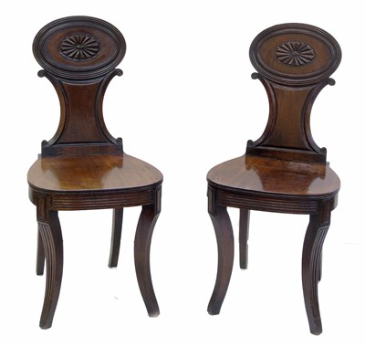 Lot 503 - Pair of Regency mahogany hall chairs.