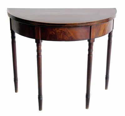 Lot 517 - George III mahogany fold-over card table.