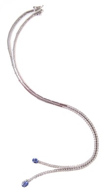 Lot 102 - Sapphire and diamond set 18ct white gold lasso drop necklace.