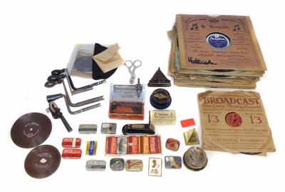 Lot 152 - A collection of early 20th century gramophone needle boxes along with three record cleaning pads.