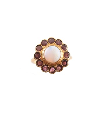 Lot 305 - An opal and garnet cluster ring