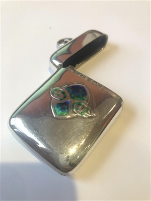 Lot 19 - A Liberty & Co. Cymric silver and enamel vesta case designed by Archibald Knox