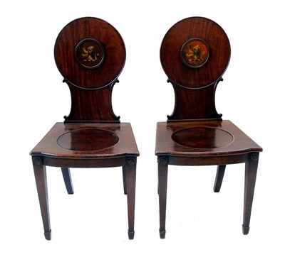Lot 609 - A pair of George III mahogany hall chairs