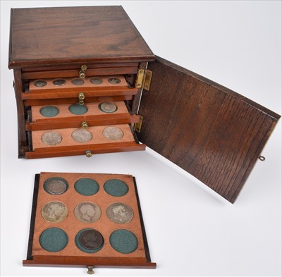 Lot 124 - Coin cabinet containing Queen Elizabeth I Shilling and other coins and tokens.