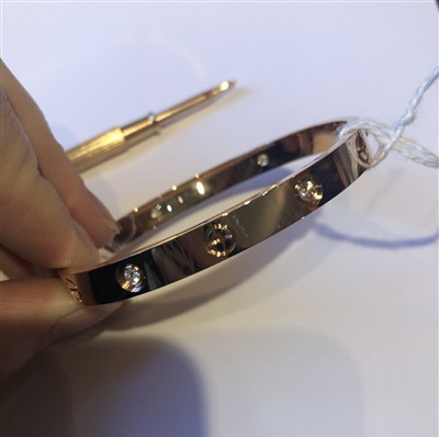 Lot 52 - A Cartier diamond LOVE bangle