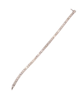 Lot 61 - An 18ct gold diamond tennis bracelet