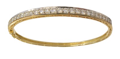 Lot 65 - A diamond hinged bangle