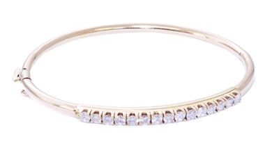 Lot 72 - A diamond hinged bangle