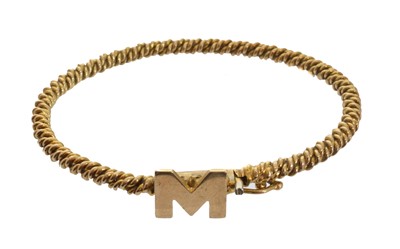 Lot 70 - A 9ct gold initial bangle