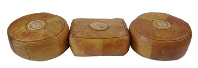 Lot 601 - A pair of 20th century brown leather circular foot stools and one other