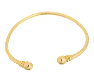 Lot 20 - A torque bangle