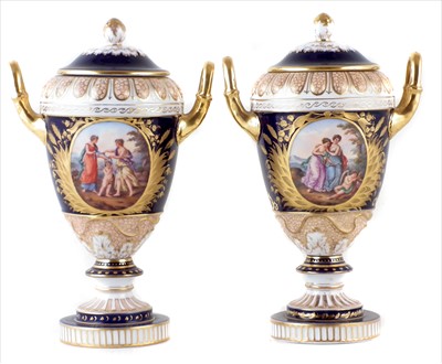 Lot 137 - A pair of Dresden twin handled lidded vases