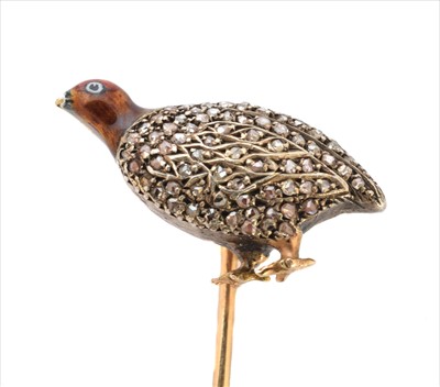 Lot 73 - A diamond and enamel stick pin