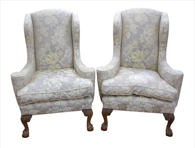 Lot 292 - A pair of early 20th century wing-back Georgian style deep seated chairs
