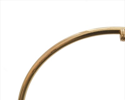 Lot 7 - A 9ct gold Gucci bangle