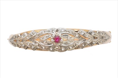 Lot 6 - A ruby and diamond hinged bangle