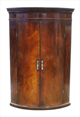 Lot 315 - George III mahogany corner cupboard